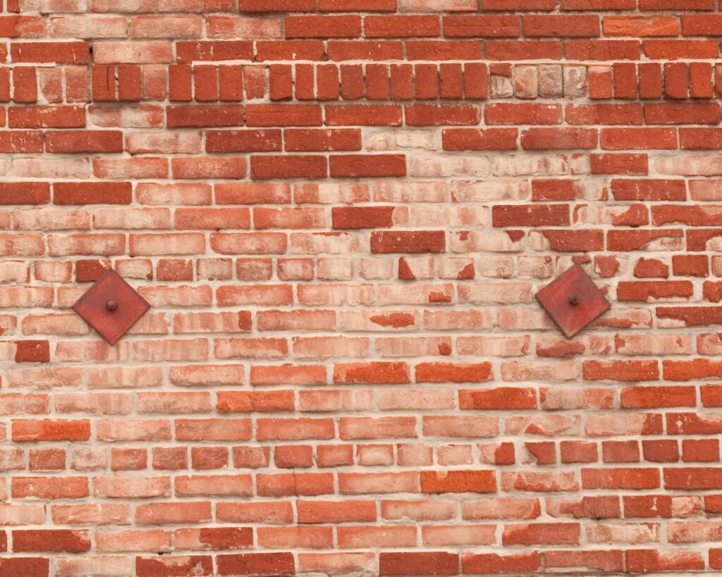 Earthquake retrofitted brick wall