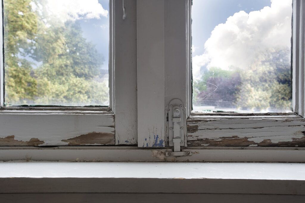 A window that has been affected by dry rot