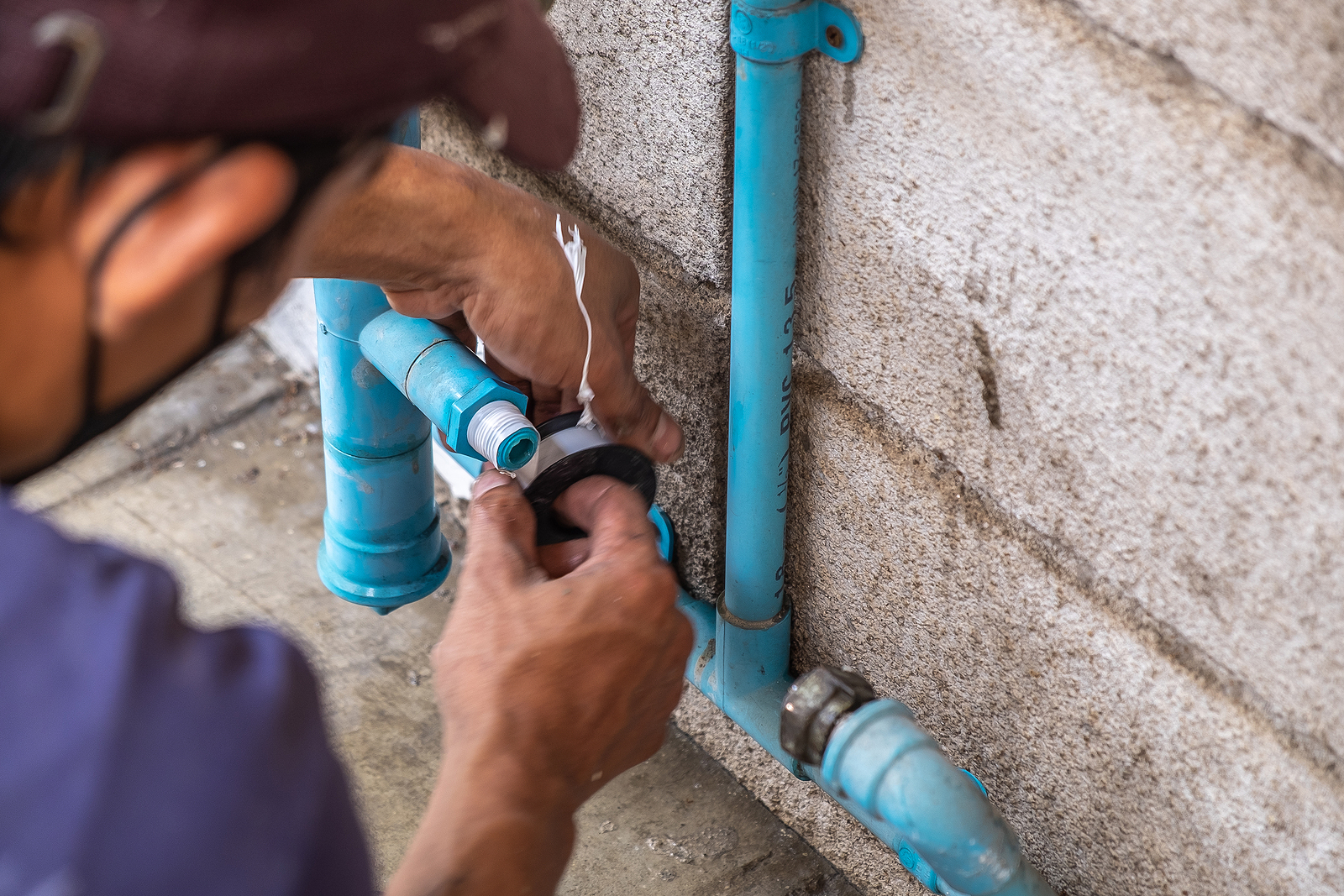 Image of a leak repair technician repairing a residential leak