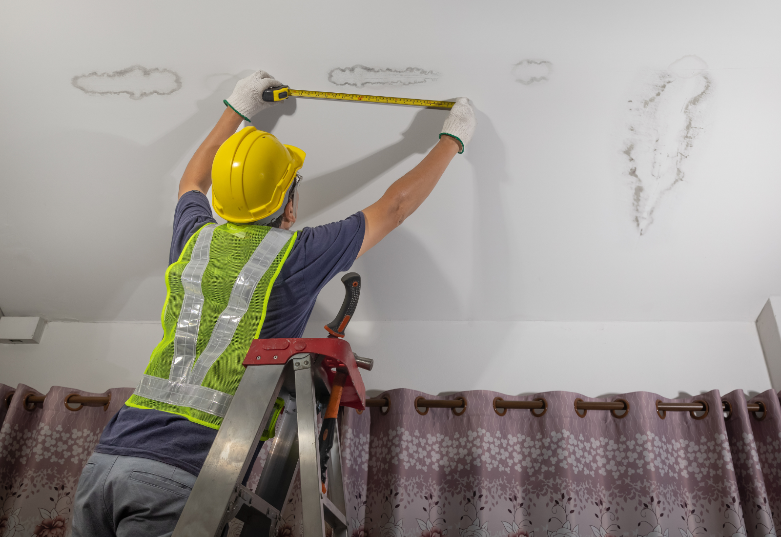 Image of a licensed contractor repairing a water leak