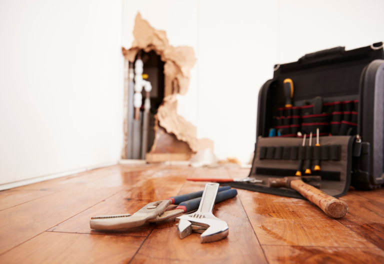 Image of tools on the floor of a damaged property