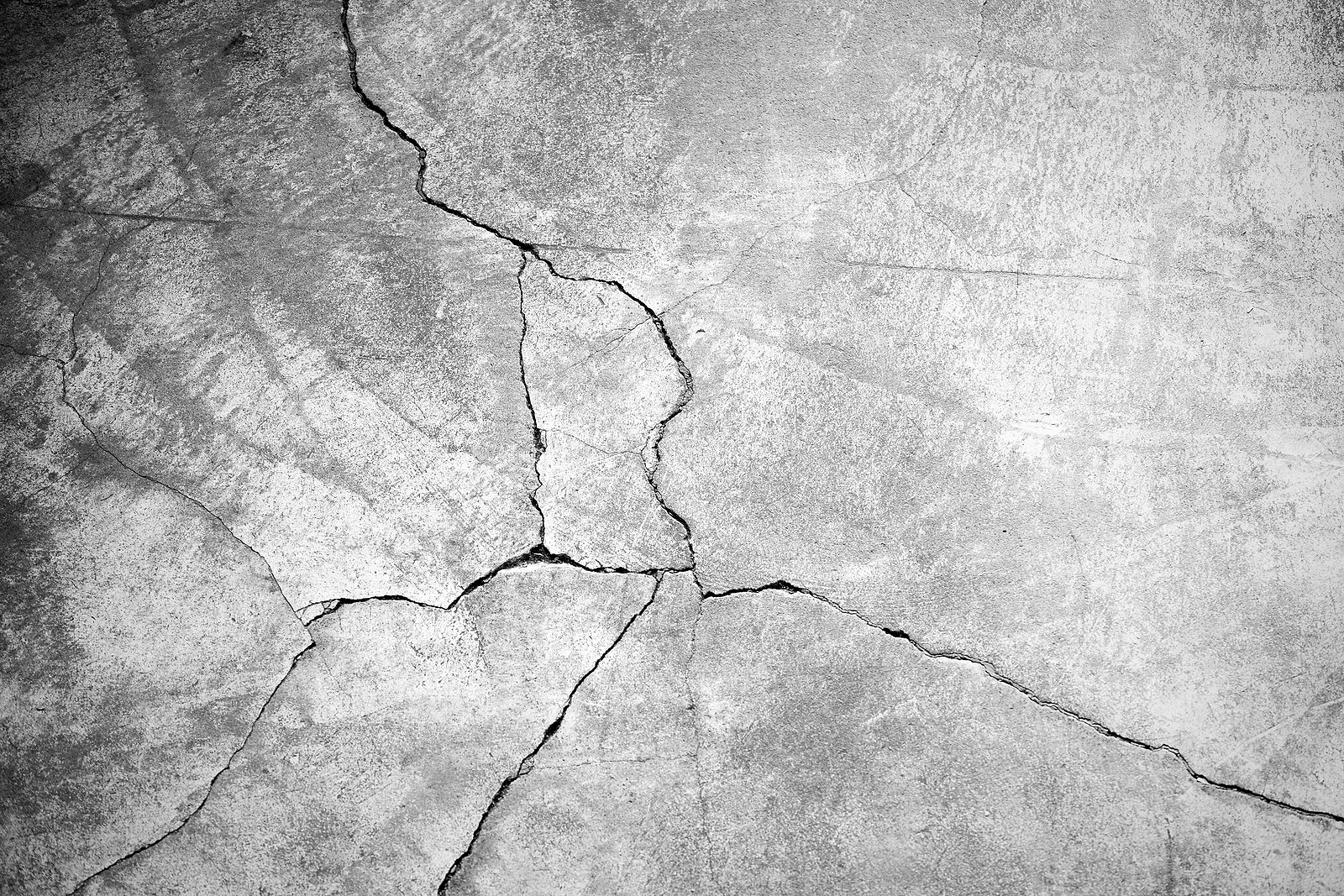 Image of a stucco wall with a crack