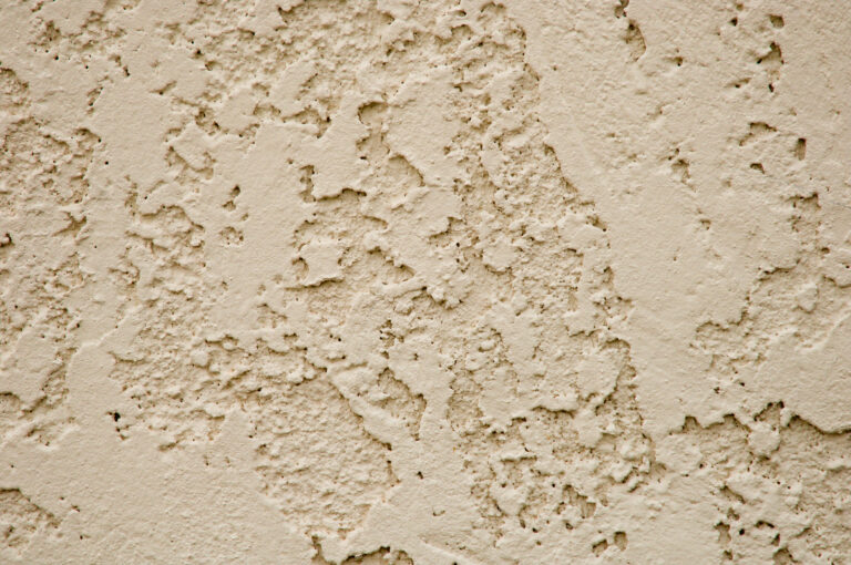 Beige texture of stucco on a wall.