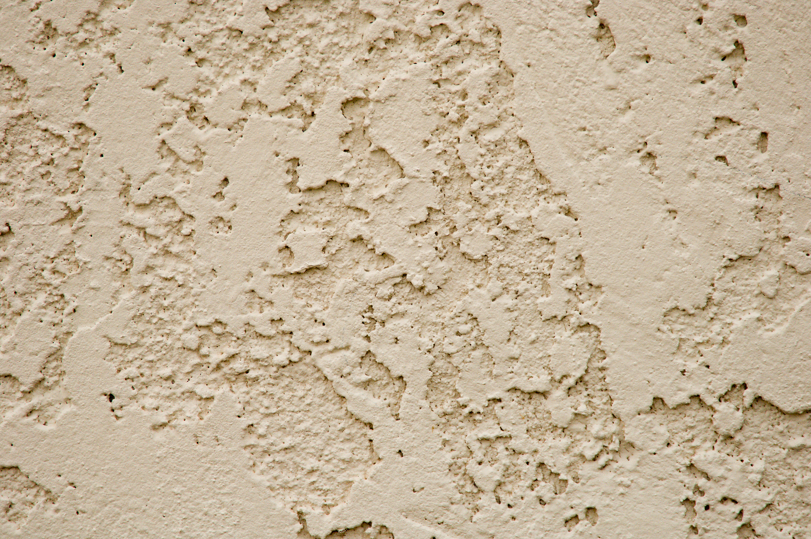 Beige texture of stucco on a wall.